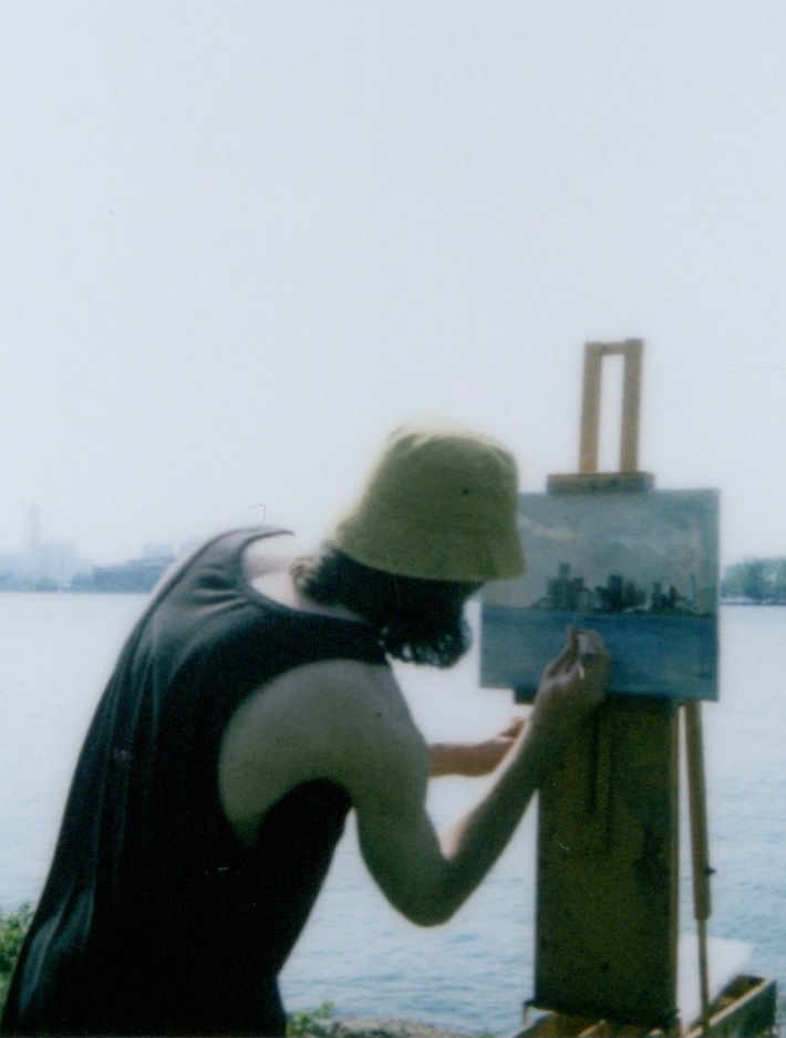 Julian Kane painting en plein air by the water